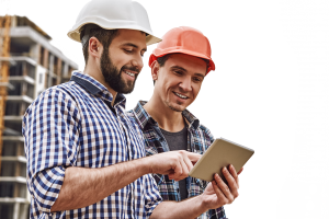 Construction crew reading spec sheet